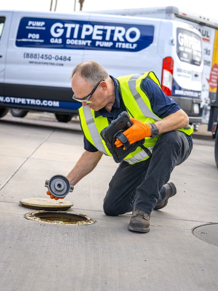 GTI technician servicing a sump on the forecourt