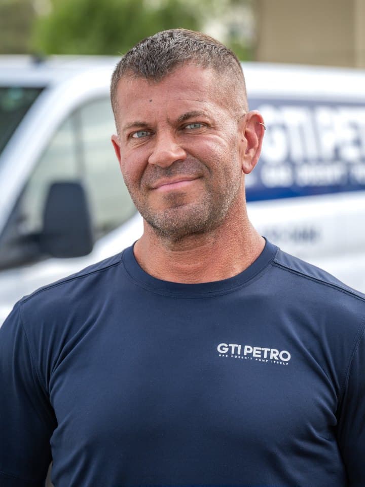 GTI technician beside a service van
